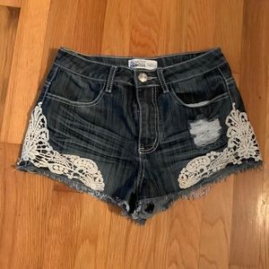 A pair of Almost Famous denim shorts.